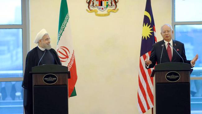 Iranian President Hassan Rouhani invited Malysian companies to invest in Iran’s oil, gas and petrochemical industry, unveiling plans to double the volume of economic ties between Tehran and Kuala Lumpur in the post-sanctions era.