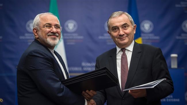 Iranian Foreign Minister Mohammad Javad Zarif and his Romanian counterpart, Lazar Comanescu, have signed two documents of cooperation during a meeting in the Romanian capital of Bucharest.