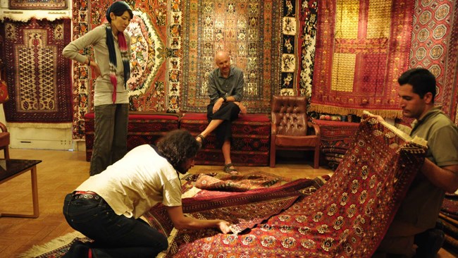 The head of Iran National Carpet Center (INCC) says it will file a lawsuit with international tribunals against fresh sanctions imposed by the US on the imports of hand-woven Iranian rugs into the country.