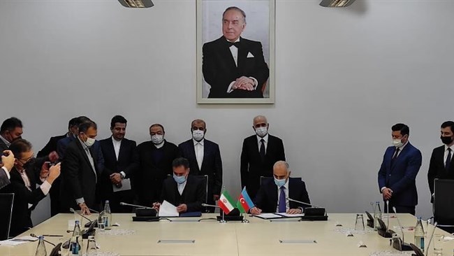 Senior transportation officials from Iran and Azerbaijan signed an agreement on Tuesday to construct a road bridge on Astarachay River running along the joint border.